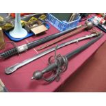 Four Reproduction Wall Hanging Swords, with scrolled guards, overall 108cm each with scabbard and