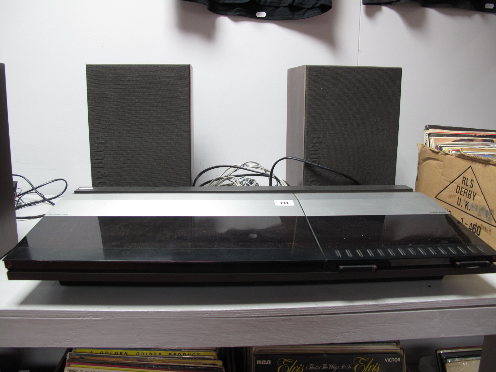 A Bang and Olufsen (B & O) Beocenter 2100, and a pair of B & O Beovox MC35 speakers.