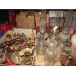 Various Paraffin Lamps, loose glass chimney's, brass and copper jugs, ladles and other item:- Two