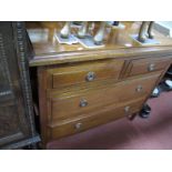 An Early XX Century Walnut Chest of Drawers, with a low back two short drawers, two long drawers