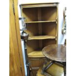 Ercol Freestanding Corner Cabinet, with open shaped shelves over panelled door, 183cm high,