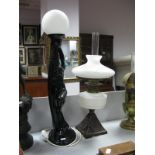 An Iron Base Lamp Circa 1900, with white glass well, Art Deco style table lamp as a semi clad