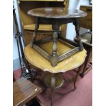 An Early XX Century Walnut Centre Table, on carved cabriole legs, with undershelf, together with