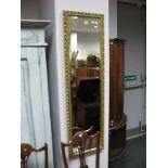 Two Rectangular Bevelled Wall Mirrors, in gilt frames.