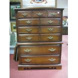 A Walnut Style Chest of Drawers, with six long drawers, on bracket feet.