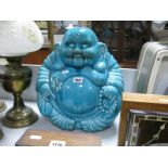 Pottery Figure of Buddah, with all-over turquoise glazing, 38.5cm high.
