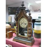 A Circa 1900 Junghans Mantel Clock, carved arched hood within turned finial, half turned pilaster