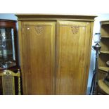 A XIX Century French Pine Wardrobe, with gadrooned top, twin panelled doors, on small turned feet.