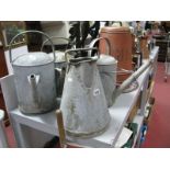 Three Galvanised Watering Cans, without the tops, galvanised jug and a copper posher. (5)