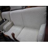 A Cream and Diamond Pattered Fabric Two Seater Settee, easy chair and footstool.