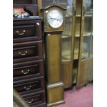 An Oak Cased Granddaughter Clock, eight day, silvered dial, Arabic numerals.