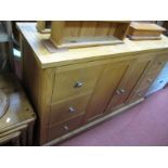 A Morris Furniture Company Light Oak Sideboard, fitted with two banks, of three drawers, central