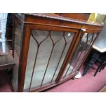 A 1920's Walnut Display Cabinet, with a low back, glazed doors, on carved cabriole legs.