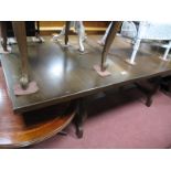 An Oak Rectangular Shaped Dining Table, with shaped supports.