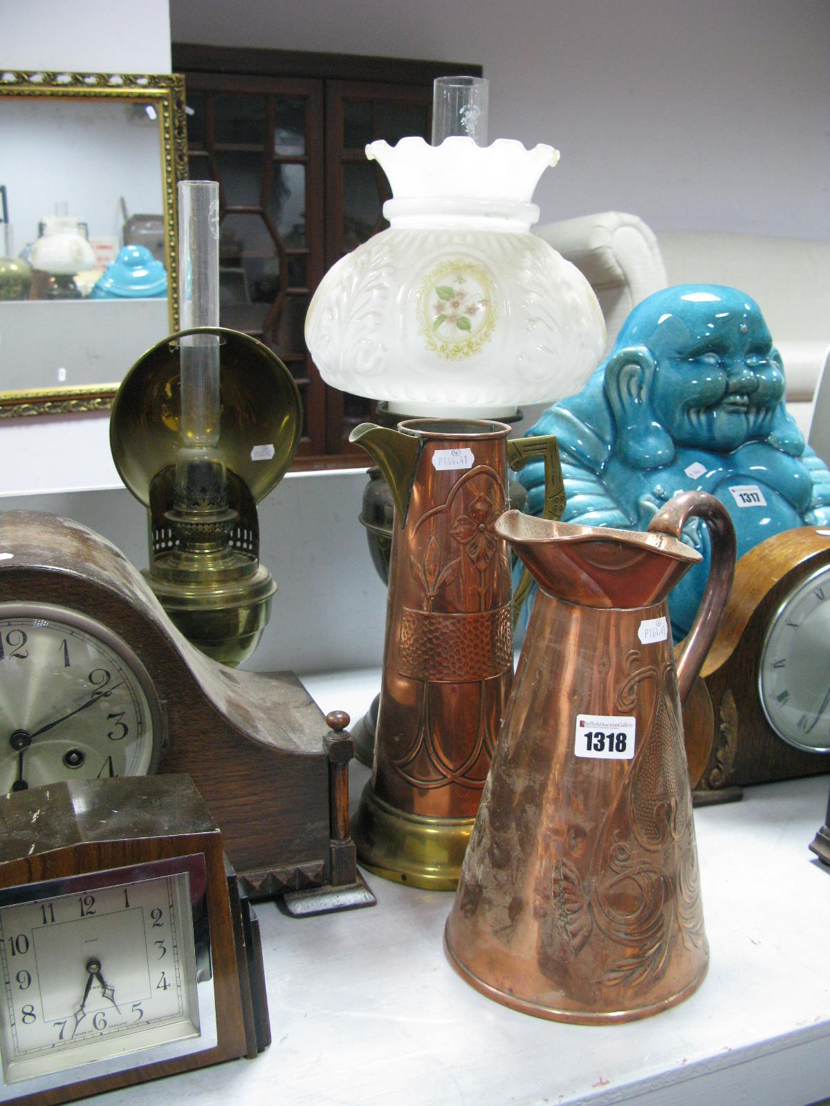 A Victorian Brass Paraffin Lamp with Reflector, a further lamp with moulded white glass shade, and