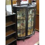 A XX Century Display Cabinet, with glazed doors, on cabriole legs, pad feet.