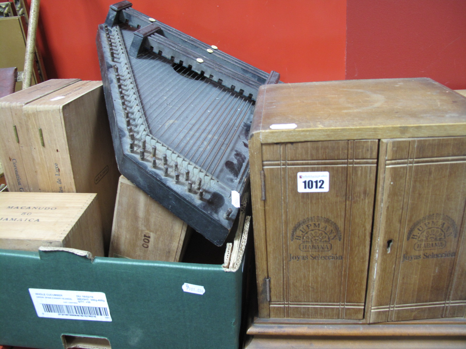 A Wooden Four Tray Cigar Presentation Box, wooden cigar boxes, a wooden stringer instrument.