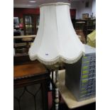 An Onyx and Brass Standard Lamp, a brass standard lamp, a pair of brass table lamps and one other (