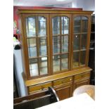 Younger Furniture Display Cabinet, with glazed doors, three top drawers, over cupboard doors, on