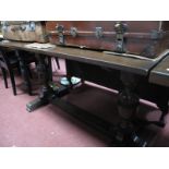 An Oak Rectangular Shaped Refectory Table, on cup cover supports, central stretcher..