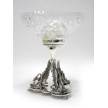 A Decorative Plated Dish Centrepiece, the shaped base with three sylised swans, supporting removable