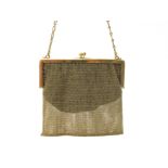 A Mesh Link Ladies Evening Bag, the plain frame (13.6cm wide) stamped "750", with fancy link chain