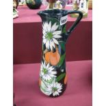 A Moorcroft Pottery Jug, painted in the 'Resplendent Quetzal' pattern, designed by Vicky Lovatt,