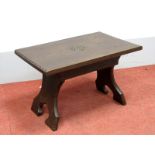 Jack Grimble; An Oak Coffee Table, rectangular with carved Tudor rose detail, on trestle supports,