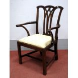 An XVIII Century Mahogany Elbow Chair, with a pierced splat, shaped arms and drop-in seat, on square