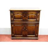 A Titchmarsh & Goodwin Style Oak Credence Cupboard, with two arched panel doors over twin panelled