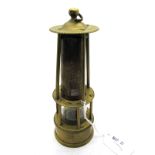 A Small Brass Miner's Safety Lamp, the upper and lower section with four and six columns