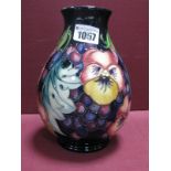 A Moorcroft Pottery Vase, painted in the 'Fruit Feast' pattern, designed by Emma Bossons, numbered