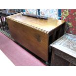 A Mid XVIII Century Mahogany Table, with rectangular top, drop leaves, on six legs with pad feet