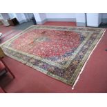 An English Wool Tassled Carpet, in the Indian manner, with central shaped motif, all-over floral