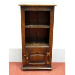 A Titchmarsh & Goodwin Style Miniature Bookcase, with a single shelf, panelled door, on stile