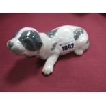 A Royal Copenhagen Porcelain Model of 'Bassett Puppy', with grey patches, designed by Peter