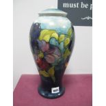 A Moorcroft Pottery Table Lamp, painted in the 'Anemone' pattern against a shaded blue ground,