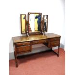 A Titchmarsh & Goodwin Oak Dressing Table, with triple mirror back, moulded edge, central drawer