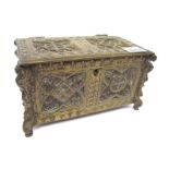 An Early XX Century Gothic Style Brass Casket, of rectangular panelled form, raised on mask legs