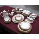 A Spode "Fleur de Lys" Pattern Bone China Dinner Service, in red, comprising six dinner plates