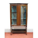 An Edwardian Mahogany Inlaid Display Cabinet, with glazed astragal doors, on tapering legs with