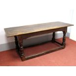 A XVII Century Joined Oak Refectory Table, with planked top, on turned and block supports with