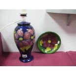 A Moorcroft Pottery Table Lamp, of baluster form, painted in the 'Anemone' pattern against a dark