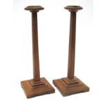 Millinery Interest; A Pair of Art Deco Hat Stands, each oak stand of tapering form and upon