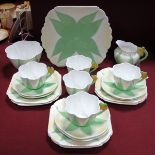 A 1930's Shelley Porcelain Part Tea Service, painted in the 'Apple Green Star' pattern with yellow