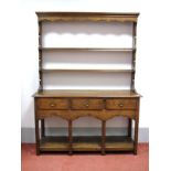 A XX Century Oak Dresser, the rack with two open shelves, base with three top drawers, on square