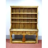 A XIX Century Pine Dresser, the rack with three shelves, two small drawers, shaped apron, shaped