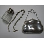 A Hallmarked Silver Purse, of shaped design, initialled, the chain handle with finger ring, a