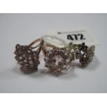 Two Modern 9ct Rose Gold Cluster Dress Rings, each claw set; together with a 9ct gold QVC dress