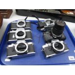 A Collection of Six 35mm Film SLR Camera Bodies, by Pentax, Olympus, Canon, including Olympus OM40